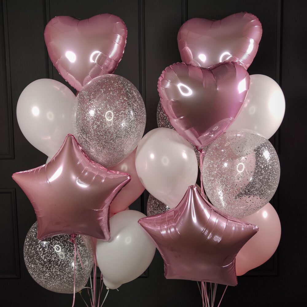 Композиция из воздушных шаров бело-розовых и прозрачных с серебряными блестками, сердцами и звездами на 8 марта